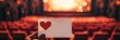 © iri.madrid.art - Romantic cinema experience on valentine day with heart symbol in theater. Horizontal banner. Copy space. Mock-up, template for cinema or theatre. White card with heart in hand, cinema background