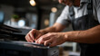 © Kateryna - Faceless happy handyman hands fixing office printer equipment repair service workplace maintenance task technical troubleshooting work professional fixing operation