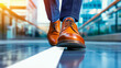 © kampolsuk - Polished brown leather oxford shoe close up walking on tiled floor in modern corridor, confident stride and motion blur convey professional commute