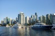 © Mara Brandl/imageBROKER - Sailing boats in marina, skyscrapers on the promenade, Coal Harbour, Vancouver, British Columbia, Canada