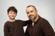 © LIGHTFIELD STUDIOS - Heartwarming moments shared between father and son in cozy sweaters