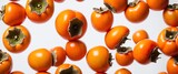Fresh kaki persimmon fruits on white.