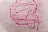 Abstract artwork featuring pink crayon strokes. A textured design showcasing delicate lines and a sense of mov