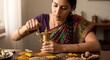 © Nelly - Young Indian woman grinding spices with traditional mortar and pestle