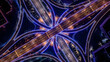 © DoThi - Aerial Night View of Illuminated Highway Interchange with Converging Roads and Lights