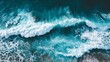 © Mitchell - Dynamic ocean waves crash with vibrant turquoise water and white foam seen from above