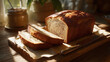 © Thiago - A close-up shot of freshly baked loaf of bread with few slices and butter