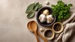 © Nataliia_Trushchenko - A bowl of garlic and parsley sits on a counter with wooden spoons. The spoons are placed on the counter next to the bowl