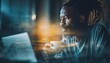 © Tetiana - Joyful African Man With A Beard Engaging In Video Call On His Modern Laptop Holding A Cup Of Coffee At Home With Young Business Partners. Blurred, Flares Effect.