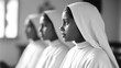 © A2Z AI  - A black and white image showcases three women in white habits, symbolizing faith, dedication, and unity, captured in a serene setting. The image evokes tranquility.