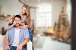 © BillionPhotos.com - Happy young parents with cute child at home