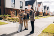 © Maria Vitkovska - Happy, smiling family receiving keys from real estate agent to new home