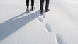 © A2Z AI  - Footprints in snow. Winter walking scene with 2 people and shadows on white snowy ground. Footprints tracking on snowy terrain. Wintery scene. Adventures in the outdoors