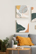 © Pixel-Shot - Cozy sofa with modern pictures and coffee table in living room
