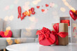 © Pixel-Shot - Table with gift boxes in stylish living room, closeup. Valentine's Day celebration