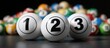 © Cherrin - Three numbered bingo balls in focus with colorful balls blurred in the background.