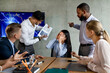 © Prostock-studio - In a modern office meeting, a multiethnic team argues over a failed project. An unhappy Asian employee faces criticism while coworkers express frustration and blame during the discussion.