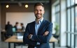 © fu - Successful business person. Portrait of male entrepreneur standing in office, posing with folded hands smiling at camera. High quality