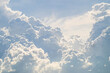 © Parichart - Mighty cumulus clouds billowing across a bright blue sky