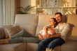 © Antonioguillem - Couple in love relaxing at sunset at home