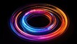 © Maharani - Glowing colorful circular light trails against a black background