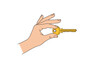 © MouSultana - A hand holding a golden key with a serrated edge and a circular head.