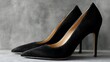 © Mahmud Creative - Elegant black suede high heel pumps showcased against a stylish, neutral background for women