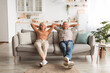 © Prostock-studio - Two cheerful seniors enjoy their time together on a comfortable sofa. They are relaxing in a bright, spacious living room filled with plants and warm decor.