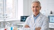 © Vasiliy - Portrait of a confident mature male scientist in a modern laboratory. Professional senior doctor smiling with arms crossed. Healthcare and medical research concept with copy space