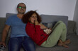 © Xalanx - Couple cuddling and watching movie