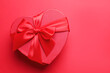 © New Africa - Happy Valentine's Day. Heart shaped gift box on red background, top view. Space for text