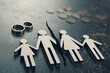 © New Africa - Divorce and alimony concept. Family figure with crack between wife and husband on table