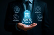 © Creative mind - A businessman with a code of conduct in hand for the concept of ethics and business.