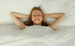 © rohappy - Woman sleeping lying in bed on white soft comfortable pillow in bedroom at home