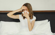© rohappy - Sick exhausted young woman sneezing blow nose using tissue, unhealthy suffering girl feels unwell
