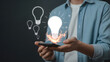 © Shahid - Brilliant startup idea ignites with electric energy emerging from a modern smartphone screen
