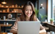 © Gianna - Young freelancer woman using laptop computer sitting at cafe table. Happy Smiling Girl Working Online Or Studying And Learning While Using Notebook. High quality