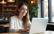 © Gianna - Young freelancer woman using laptop computer sitting at cafe table. Happy Smiling Girl Working Online Or Studying And Learning While Using Notebook. High quality