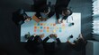 © InfiniteFlow - Smart cooperate business people writing and brainstorming business idea by using sticky notes. Top view of diverse project manager sharing marketing strategy on meeting table. Teamwork. Directorate.