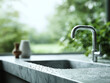 © SolaruS - Serene kitchen scene featuring a modern faucet and water droplets on a marble countertop. Natural light streams through the window, blurring natures beauty. Perfect for home design.