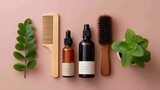 Natural Hair Care Essentials With Wooden Comb, Glass Bottles, Green Leaves, and Fresh Mint on Soft Pink Background for Spa and Wellness Promotion