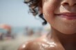 © Asier - Child's wet skin and mouth smiling on a sunny beach day