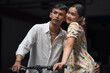 © surachetkhamsuk - Young Asian Couple enjoying a bicycle in the city, man and woman relaxing together outside.