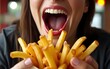© Christian - Close-up of woman eating French fries in a pub. High quality