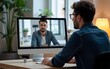© Lucy - Man uses laptop computer to video chat with coworker. Virtual meetings, freelance work, e-learning, online communication, and telecommuting are all depicted. High quality