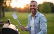 © Elizabeth - A joyful image of a father smiling while standing beside a grill, holding a spatula, with a relaxed outdoor background, creating a friendly and welcoming atmosphere. High quality