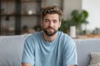 © Serhii - Millennial Man on Sofa Engaged in Video Call, Captivating Camera Connection While Chatting from Home