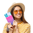 © Damir Khabirov - Smiling young traveler holding passport and boarding passes, ready for her next trip with joyful anticipation