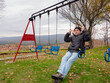 © Jose maria ceballos  - Senior man swinging on playground recreating with joy