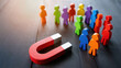 © olgakris - Customer attraction concept with magnet pulling colorful wooden figures, business lead generation strategy, marketing audience engagement, client acquisition funnel, targeted outreach